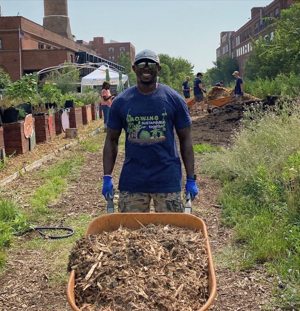 Gardeneers volunteer with wheelbarrow